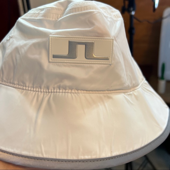 J. Lindeberg Bucket Hat in White with Gray/Silver Decal and Trim - Picture 1 of 8